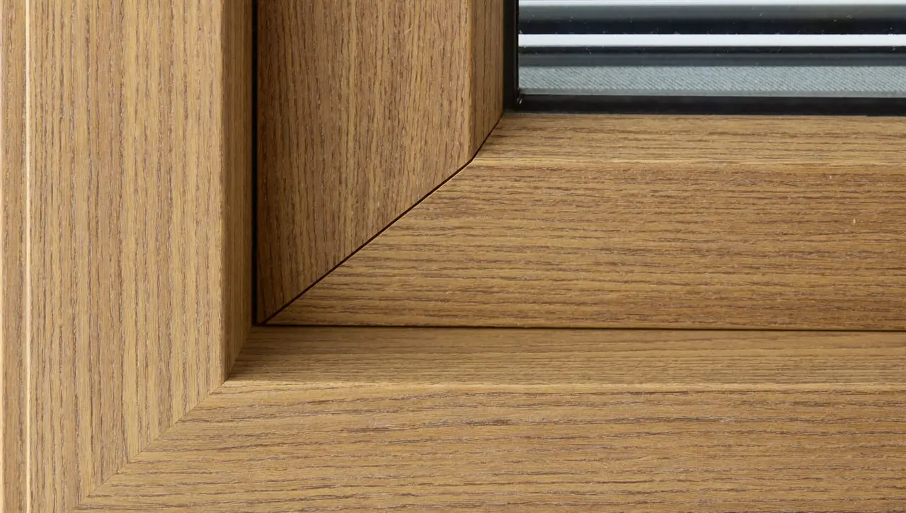 Woodgrain foil finish on a uPVC sash window recreating a timber look